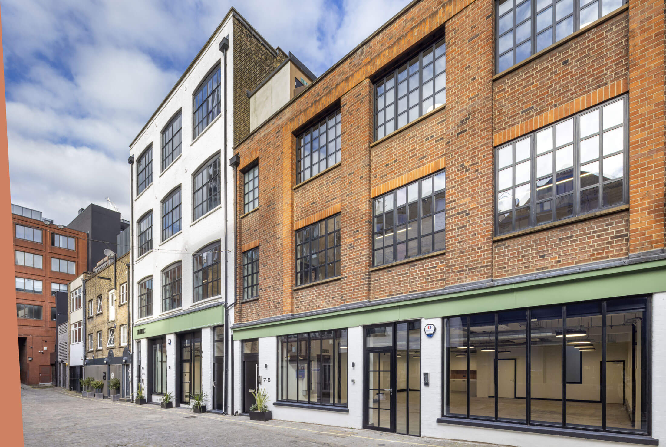 Exterior of warehouse-style office
                        space